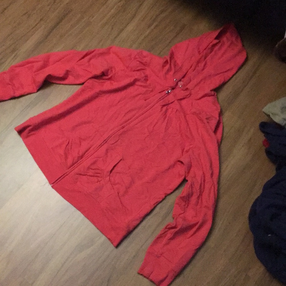 Pink zip up jacket.
